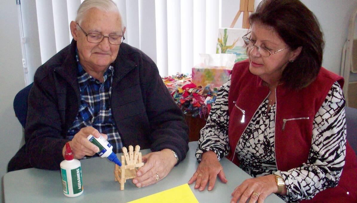 Bob Reed, who has dementia, loves peg craft and gets help from support worker Christine Kennafick.