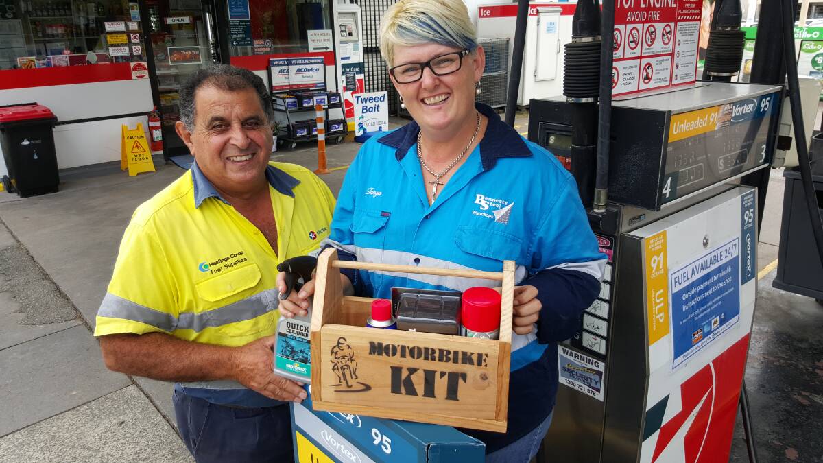 Hastings Co-op employee Fred Azzopardi and Wauchope Chamber of Commerce president, Tanya Simmons at Cedar Service Station.
