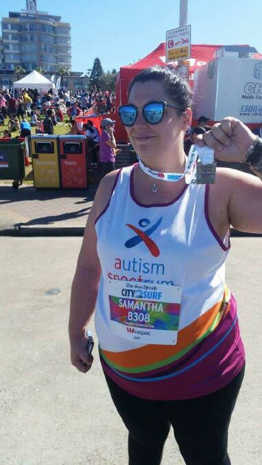 Samantha Chapman celebrates finishing the Sydney City2surf run in under three hours and raising $3,000 for the autism charity which helps her family.