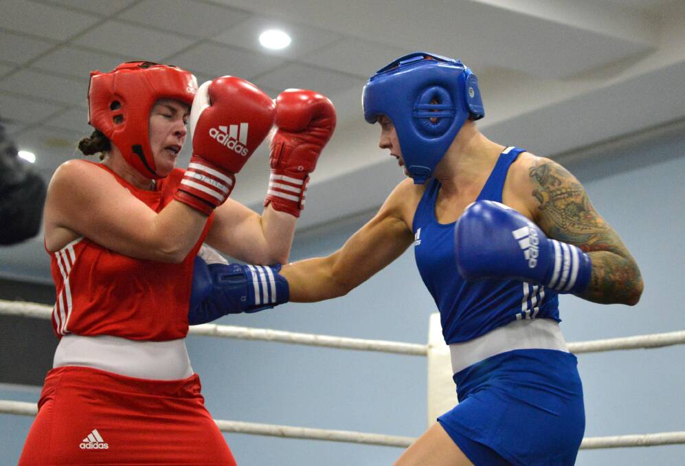 Lisa Mezzone comes up against Wauchope's Skye Hollis who won by TKO and was awarded best female boxer of the night.