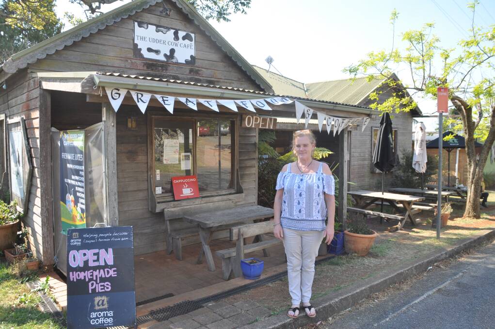 HELPING THE HEROES: Michelle Robertson from the Udder Cow Cafe in Comboyne has been providing free food and drink to volunteer firefighters at the bush fire.