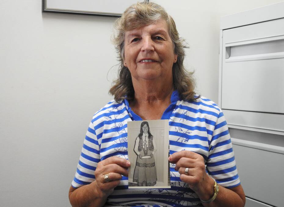 Marcia Armfield with the photo of her winning Best Female Performer at the Parkes Country Music Festival back in 1979.