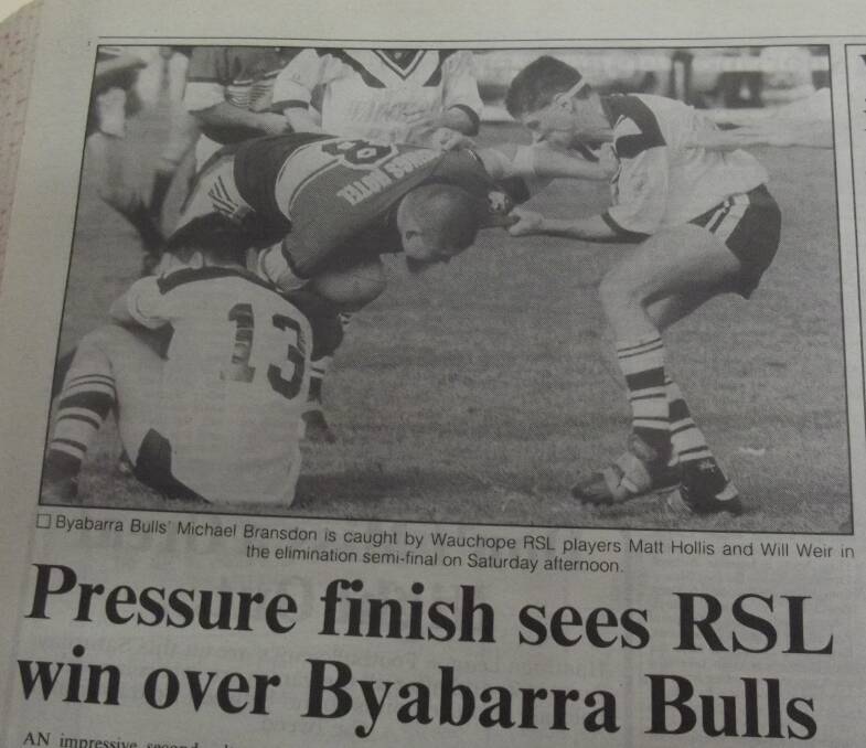 Byabarra Bulls' Michael Bransdon is caught by Wauchope RSL players Matt Hollis and Will Weir in the elimination semi-finals.