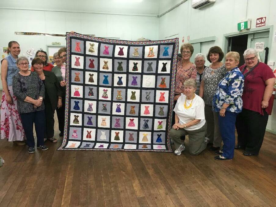 Many hands make light work: the Frocktober quilt by Wauchope Patchwork Quilters.