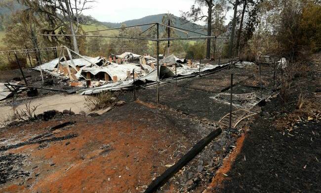 STILL MUCH TO BE DONE: The remains of one home burned in the devastating Pappinbarra bushfires in February.