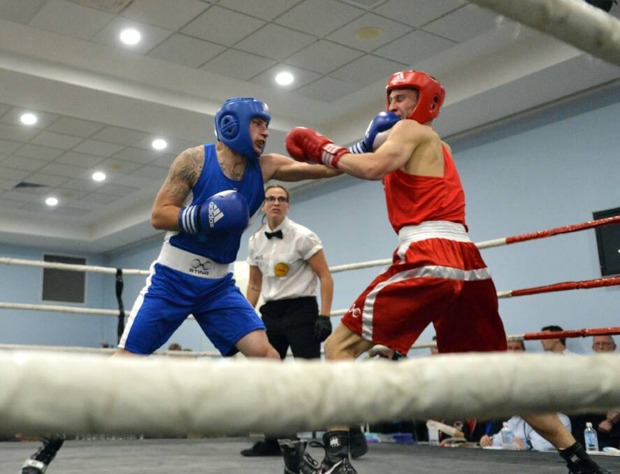Wauchope's Brock Hollis in the ring with Dylan King.  Brock won by TKO and was also awarded best local boxer.