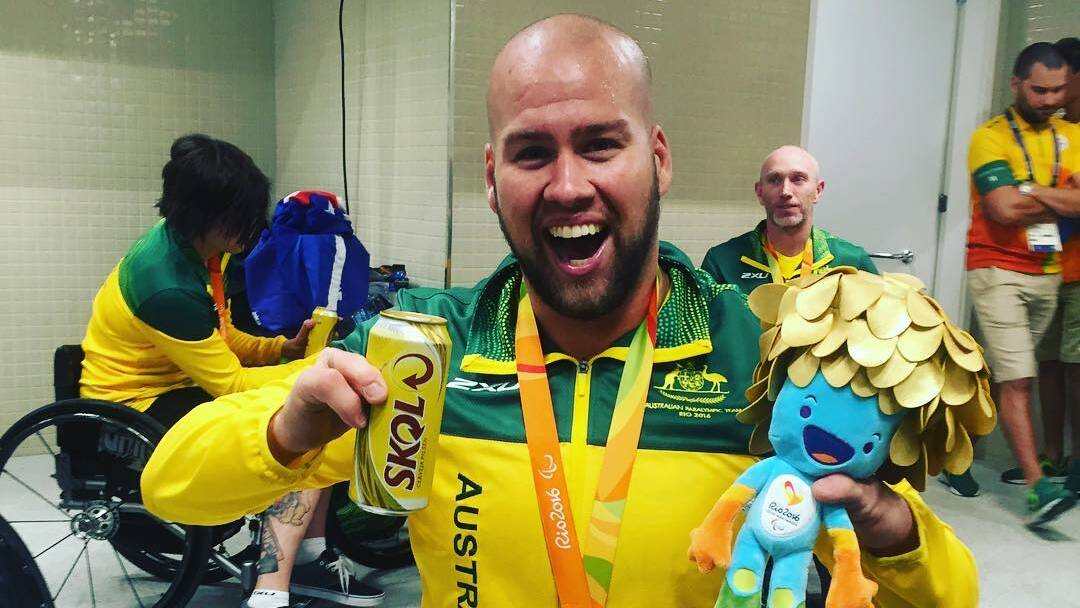 Loving life: Ryley Batt in the dressing rooms moments after Australia claimed back-to-back gold medals. He says it still hasn't sunk in.