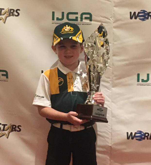 BIG PRIZE: Greta golf prodigy Harry Preece with his world stars trophy in Las Vegas last month. Picture: Supplied