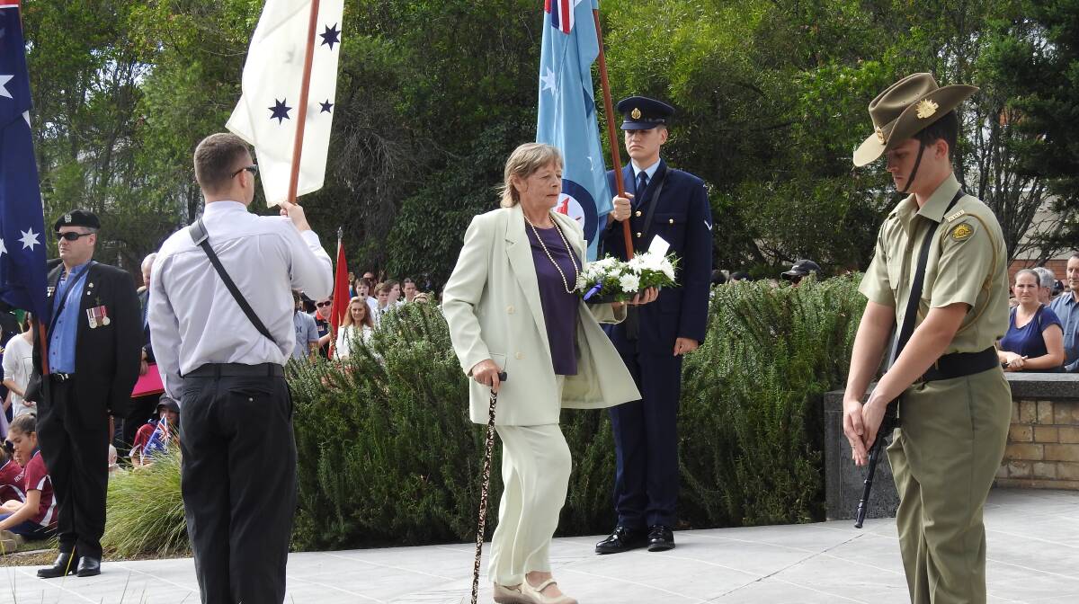 Lest we forget: Port Macquarie-Hastings Council deputy mayor Lisa Intemann prepares to lay a wreath at the Wauchope Cenotaph on Anzac Day.