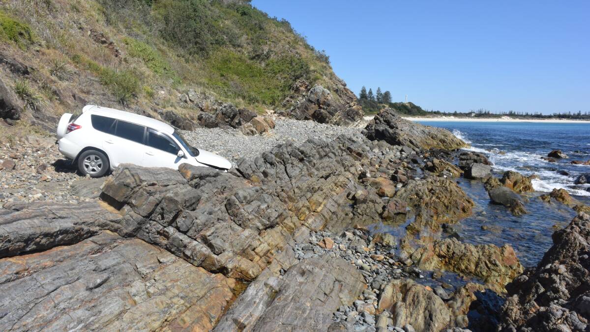 The car plunged 20 metres onto rocks at Second Head, Forster on Monday night.
