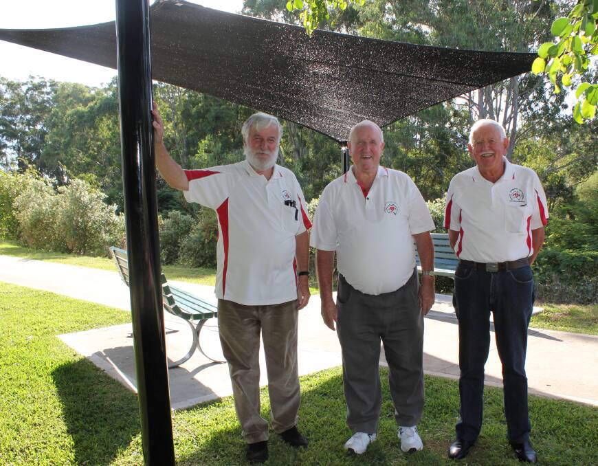 Welcome addition: Heart Support members Reg Wilkinson, Mike Storrier and Max Heslehurst proudly show off the new shade sail and seats installed along the Heart Support walkway at the rear of Port Macquarie Base Hospital.
 