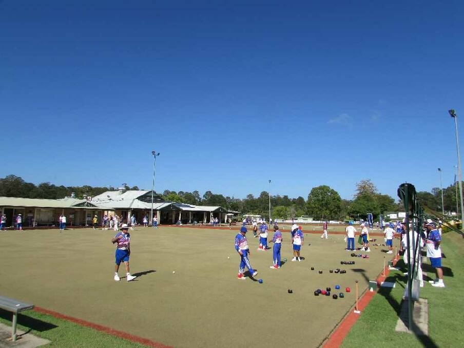 Full greens: Some of the 112 bowlers who played at Wauchope's annual Harcourts Pig Day on Sunday