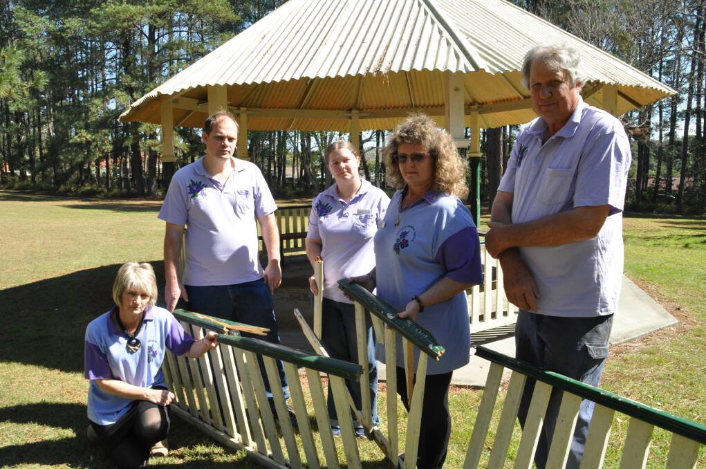 Many hands make light work: Lasiandra Festival Committee members Sheryl Barnett (kneeling), James Wallis, Heather McPhail, Chrissy Jones and president Sam Elphick are hoping residents will roll up their sleeves and help out with Lasiandra Park's makeover.