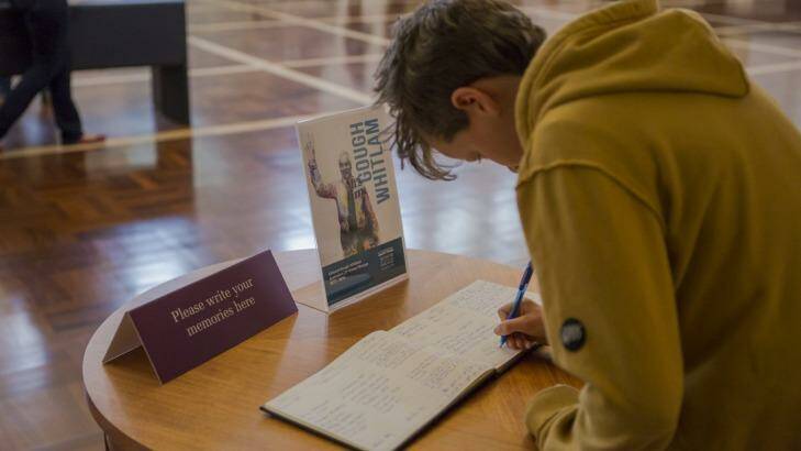 Tribute: Willoughby Duff 11, of Perth, signs the condolence book. Photo: Jamila Toderas