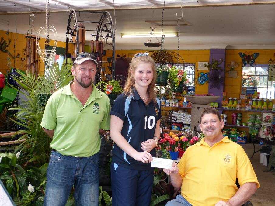 Big help: John Carr from Greenbourne Nursery and Stephen Perkins, President Wauchope Lions Club presenting Skye Auld with a cheque to assist in the cost of attending the recent U16's National Volleyball Titles in Adelaide.