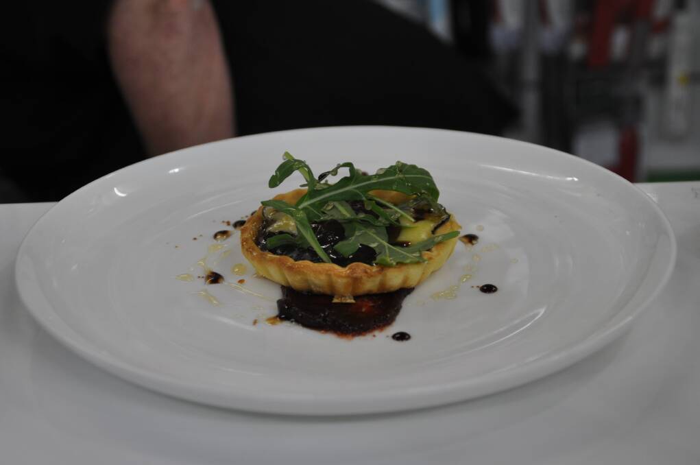 Terrific tart: The audience was treated to a taste of the Comboyne Bluembert& The Other Chef Onion Jam tart with East Coast Gourmet Sticky Vanilla Figs, truffle honey, The Other Chef Quince Paste, balsamic cavier and rocket.