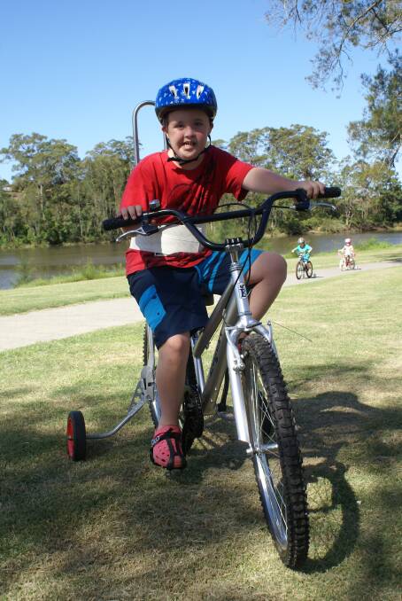 Independence: Connor Fraser enjoying his new Freedom Wheels bike