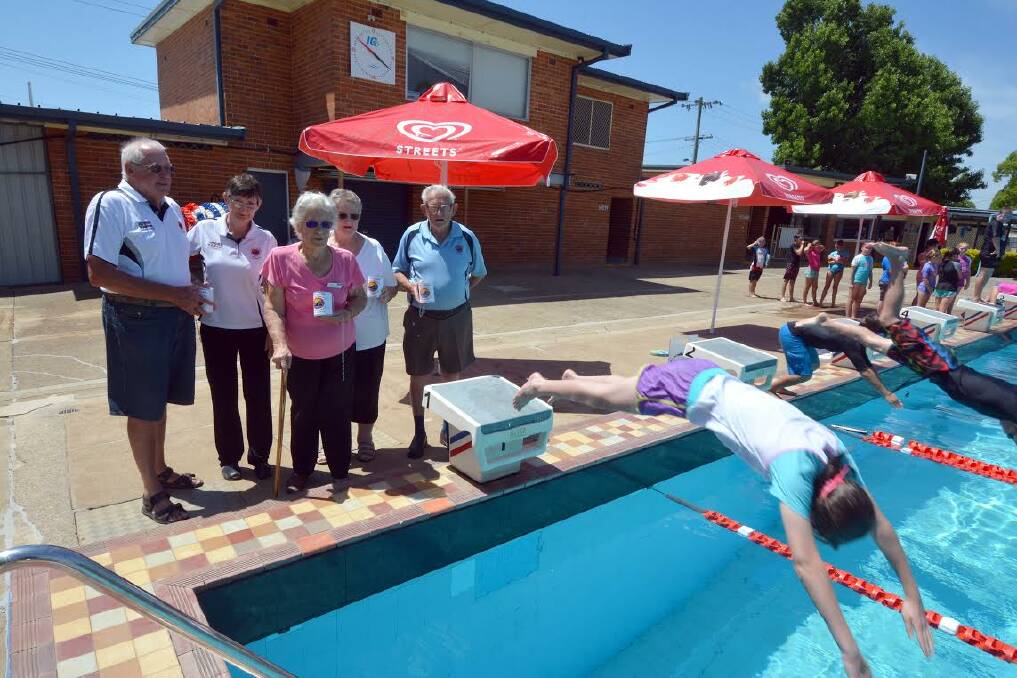 Disappointed with council decision: Wauchope Community Heated Indoor Pool Association members Graham Gillard, Diane Gilbert, Hazel Lavender, Julie Gillard and Harry Lavender with Wauchope Public school kids