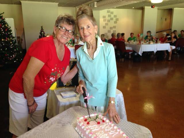 80 years young: Birthday girl Verna Jeffery cuts her cake with president Judy Loadsman.