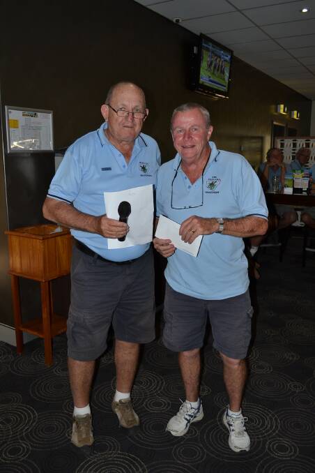Top prize: Captain Ross Bird presents winners vouchers to Ken Gallie