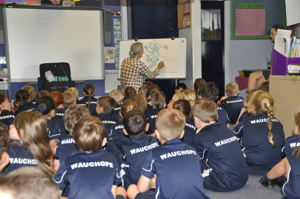 Paying attention: Children's book author and illustrator Stephen Michael King shows the Year 1 students how he draws his characters