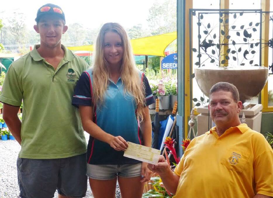 Helping hand: Brendan Harris from Greenbourne Nursery and Wauchope Lions Sports Foundation Chairman, Stephen Perkins presenting Laura Cook with her cheque.