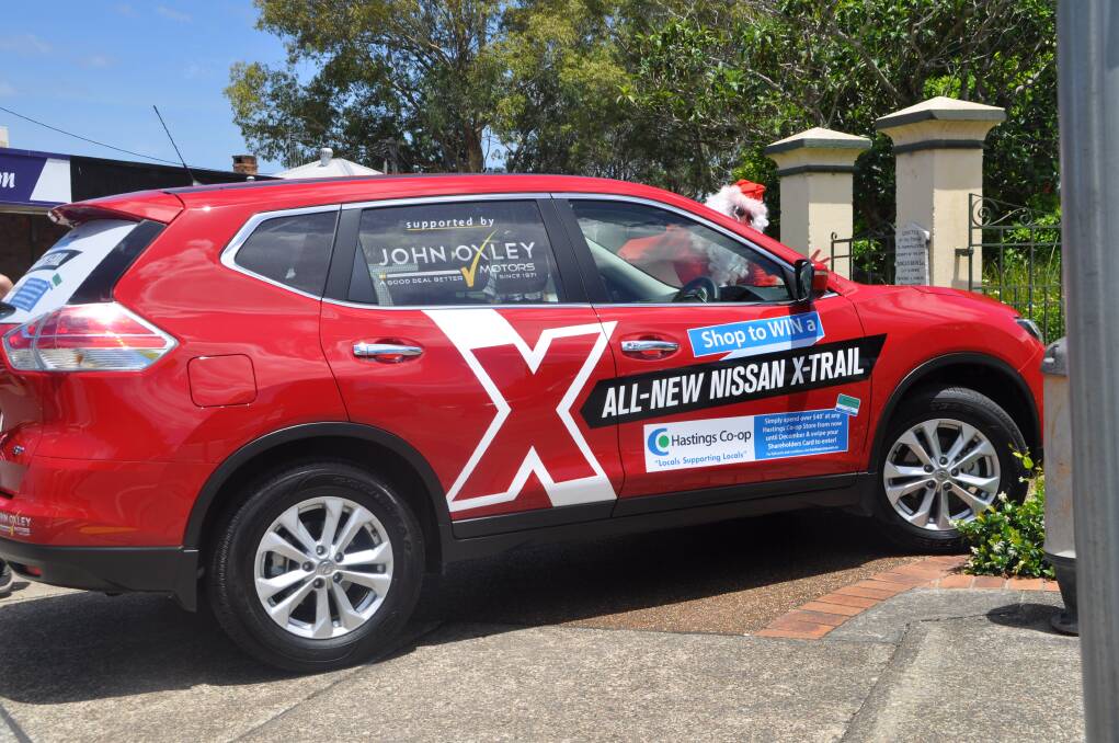 Drive in style: Santa made a dash down to Bain Park to take a final look at the Nissan X-Trail before it is handed over to the lucky winner tomorrow afternoon at the Wauchope SUPA IGA