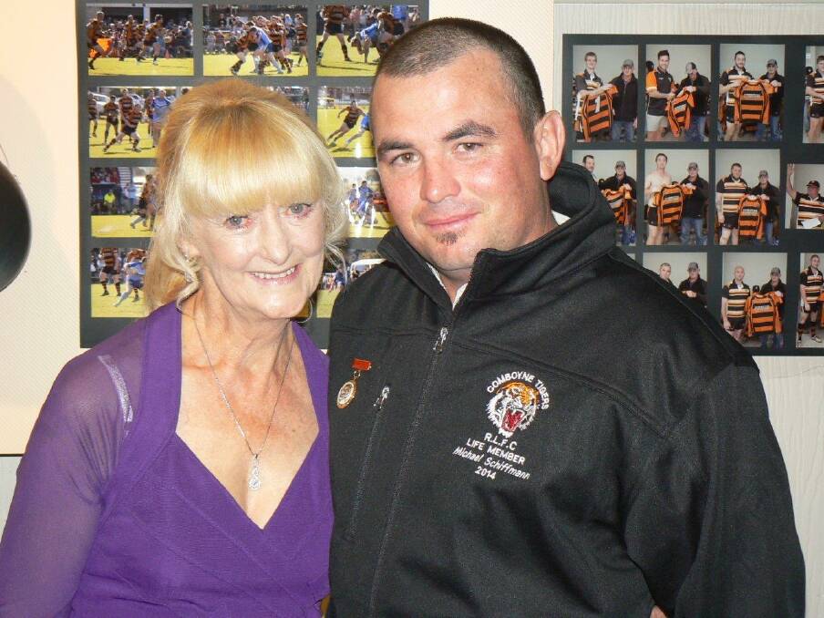 Well deserved: Kay White congratulates Michael Schiffmann on attaining life membership of the club at Saturday night's Tigers presentation dinner.