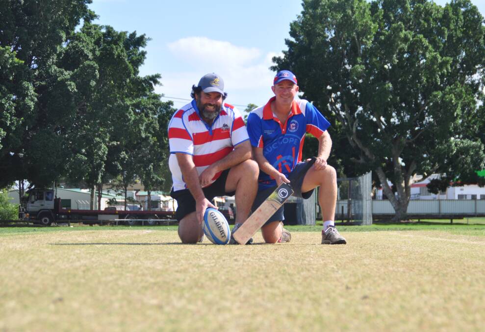 Working together: Peter Daley, president of the Wauchope Thunder Rugby Club with Wauchope RSL Cricket Club president Tony Brown on the pitch at Andrews Park.