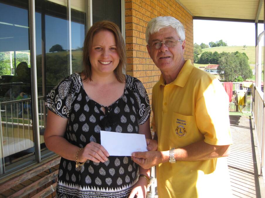 Thank you: Greg Cavanagh presenting the cheque to Donna Coombes at Comboyne RSL Club