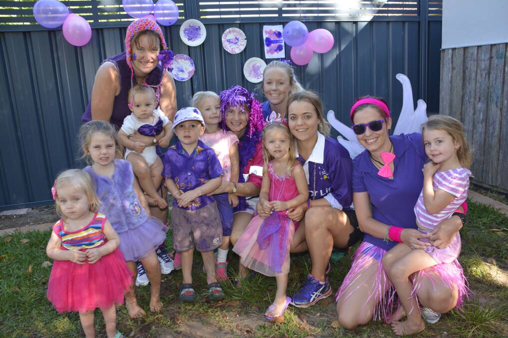 Team theme: TGs childcare team in purple for the Lasiandra Festival Purple People Day. Abigail Sheilds, Elle-Lea Paulson, Bryce Owers, Daelan Newman, Brydee Costigan, Ruby Andrews and Maddi Everson with staff Faye O'Neill, Coryl Reis, Laura Mowle, Maddi Ross and Crystal Tinker.           Pic. Peter Gleeson.