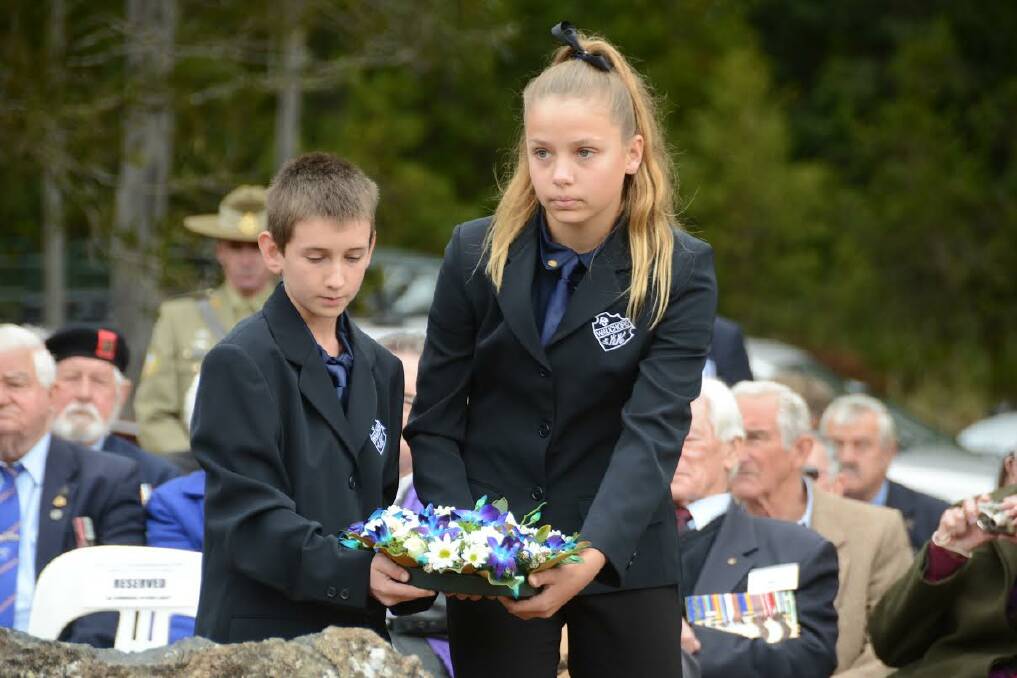 Tribute: Wauchope Primary School captains, Chad McGovern and Abbie Trotter pay their respects to Neville Howse VC, laying a wreath at the dedication of the Neville Howse VC Rest Area at Ellenborough Falls last Thursday.