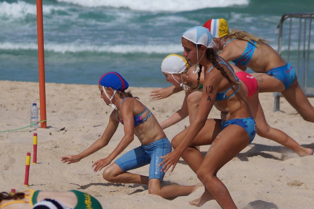 Lightening fast: Sarah Stewart (in the red and blue cap) competed in the under 12's beach flags.