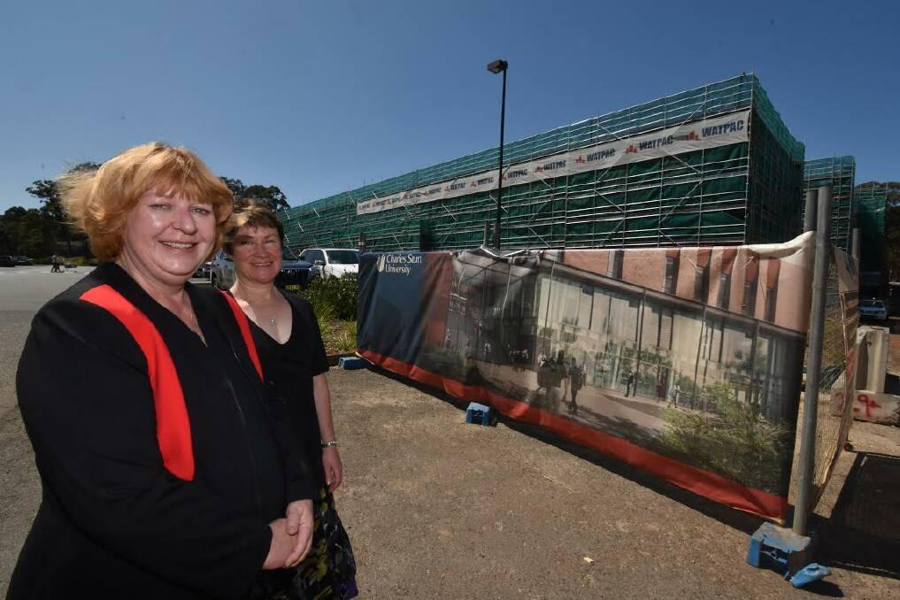 Due for completion in April: Charles Sturt University Port Macquarie head of campus Professor Heather Cavanagh and regional relocation officer Sandra Wallace are excited about progress on the new campus.