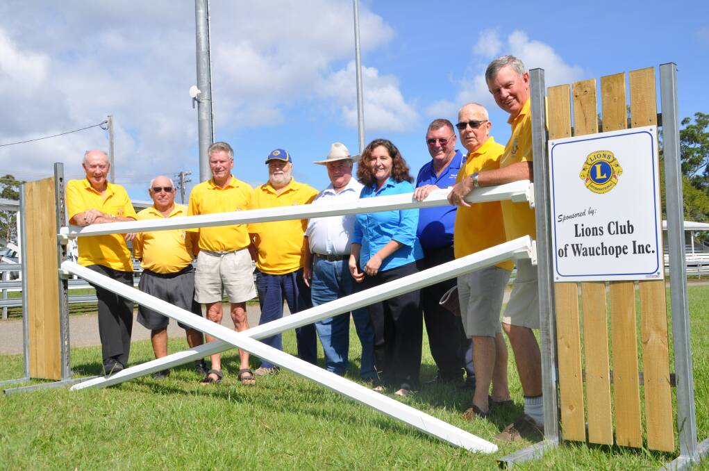 Safety first: Pictured with one of the new horse jumps are Wauchope Lions Club members, from left, Bruce Cant, Jim Calleja, Bob Jones, Gordon Douglas, chief ring steward Jeff Noakes, the Show Society secretary Justine Jeffery and president Bob Kennett, and Lions Jim Munro and Doug Allen.
