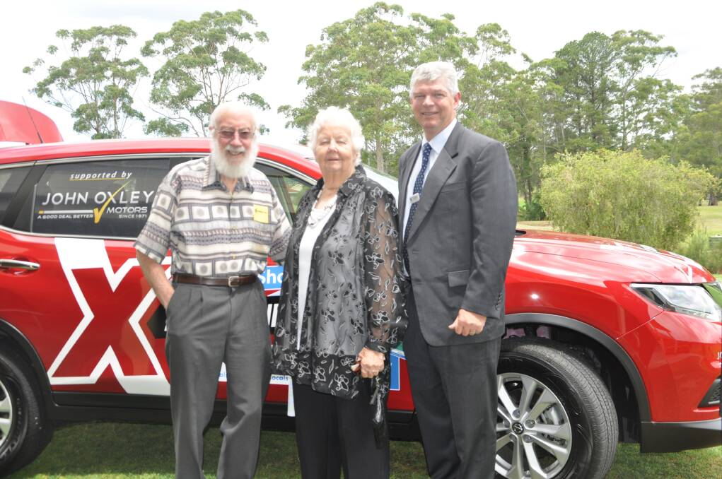 Up for grabs: Laurie and Gwenda Grime with Hastings Co-operative CEO Allan Gordon admiring the Nissan X Trail that was on show at the Co-op's AGM