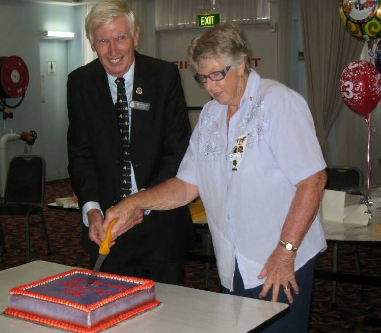 Celebrating three years in the community: Bill Wagner from the RSL Sub Branch and Dawn Nowlan cutting the cake at the Broken Bago Day Club birthday celebrations.