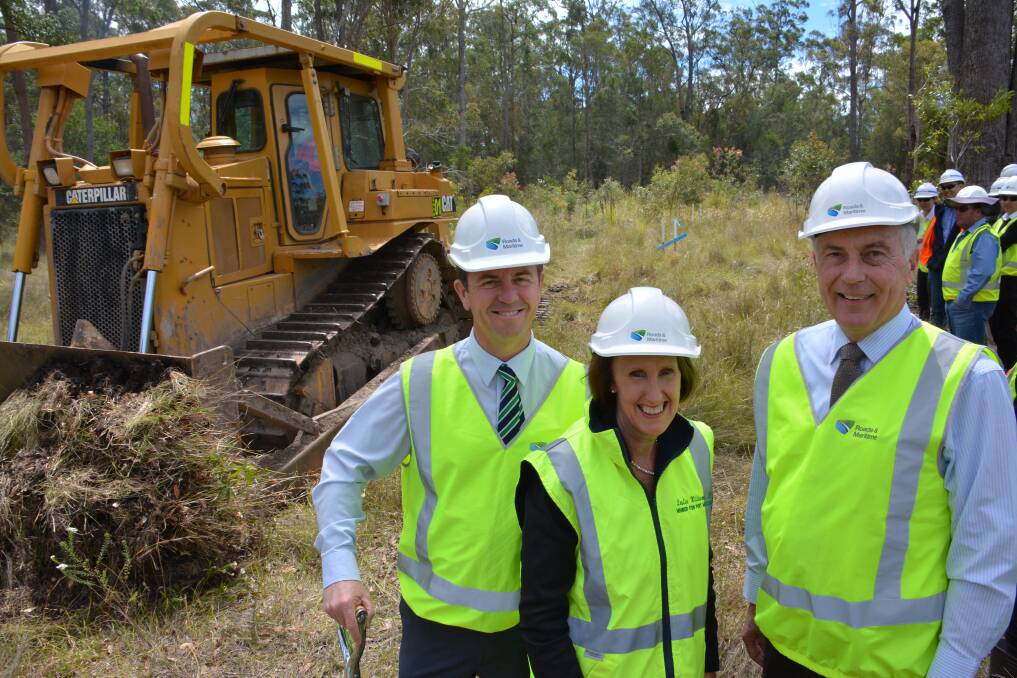 Cause for celebration: Member for Port Macquarie Leslie Williams, Deputy Prime Minister Warren Truss and Member for Lyne David Gillespie at the start of what will be the new south-bound lane of the Pacific Highway, near Kundabung.