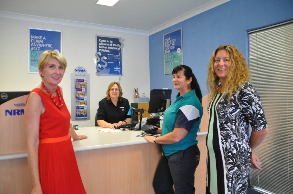 Valuable: NRMA vice president Wendy Machin, left, discusses the benefits of NRMA membership with customer Fiona Turner, centre, regional business manager Heidi Novosell, right, and insurance consultant Sue Daley, behind the counter