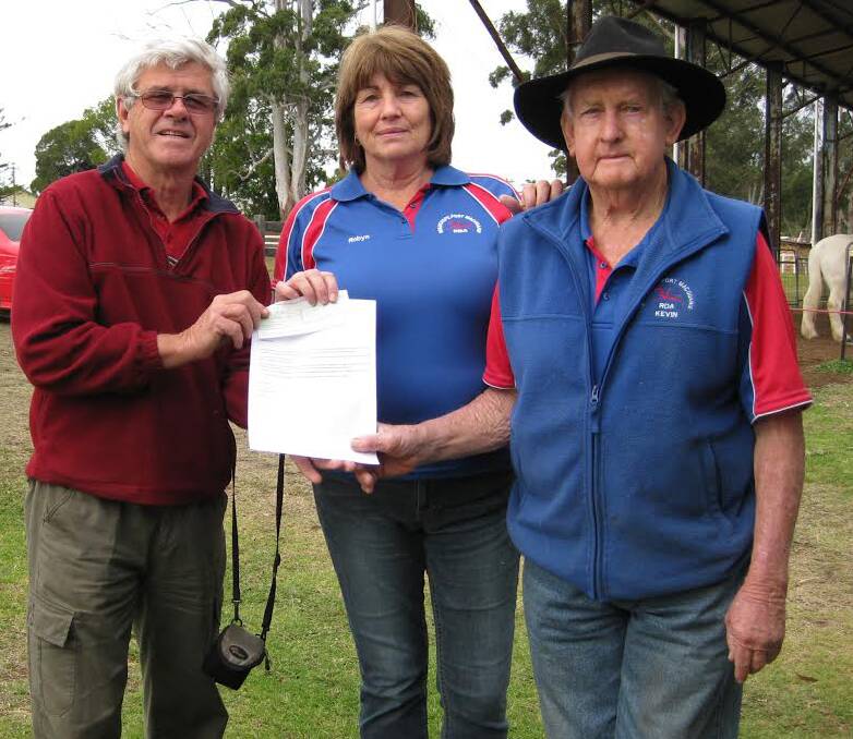 Generosity: President of Riding for the Disabled, Kevin Waldron and member Robyn O'Callaghan accepting a cheque for $400 from Club member Greg Cavanagh.