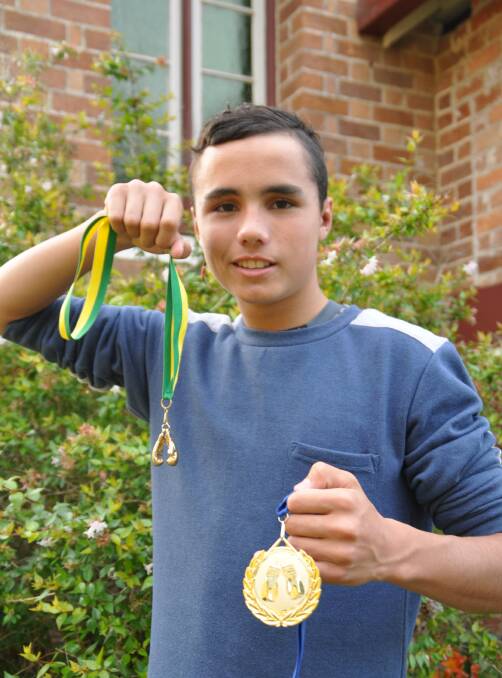 Convincing wins: Jundumarra Layton with his new Golden Gloves and state titles medal.