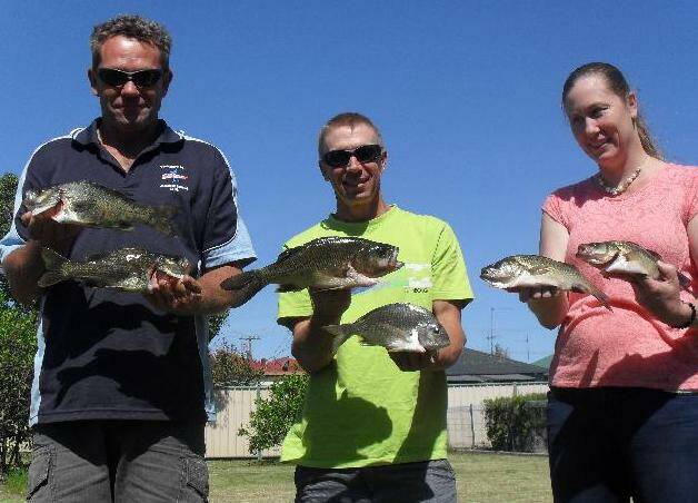 In the points: Successful fishing club members, from left, Dan (Sandy) Murphy, Mick Winchester and Donna Riddle
