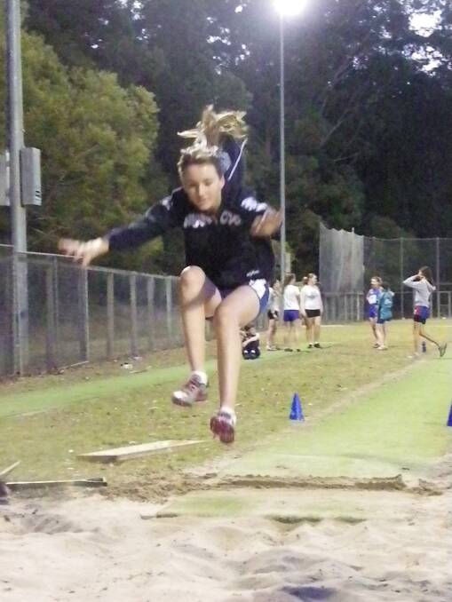 Practice: Liz Pike takes flight in the long jump
