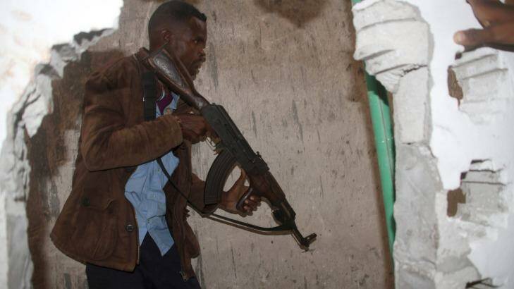 A Somali soldier takes position during an attack on a hotel in Mogadishu, Somalia, Saturday, June 25. Photo: Farah Abdi Warsameh