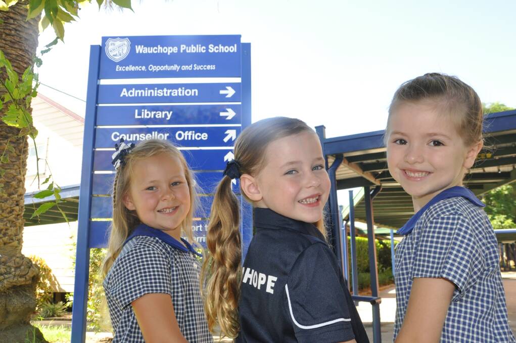Too cute for words: Best friends Alicia Smith, Lucy Lyon and Cassidy Langdon are among 100 excited children who will start at Wauchope Public School on Thursday.