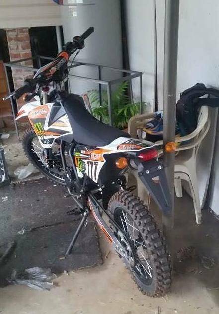 This trailer and motorbike were stole overnight Tuesday.