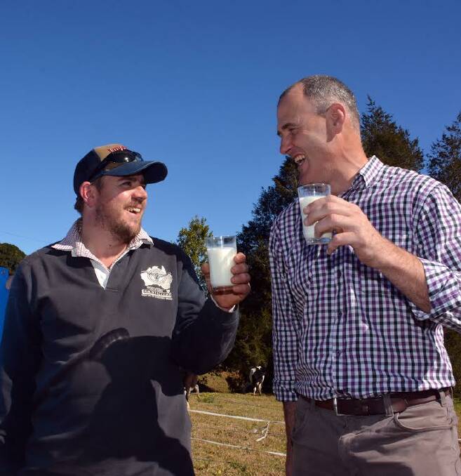 Cheers: Comboyne dairy farmer Shane Debreceny toast's the area's Legendairy success with Port Macquarie-Hastings Mayor Peter Besseling.