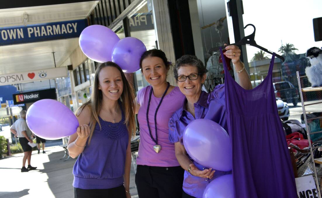 Purple power: Department Store staff (l-r) Sharni Newman, Jacklyn Lindsay and Jo Denham get into the spirit at last year's market day.