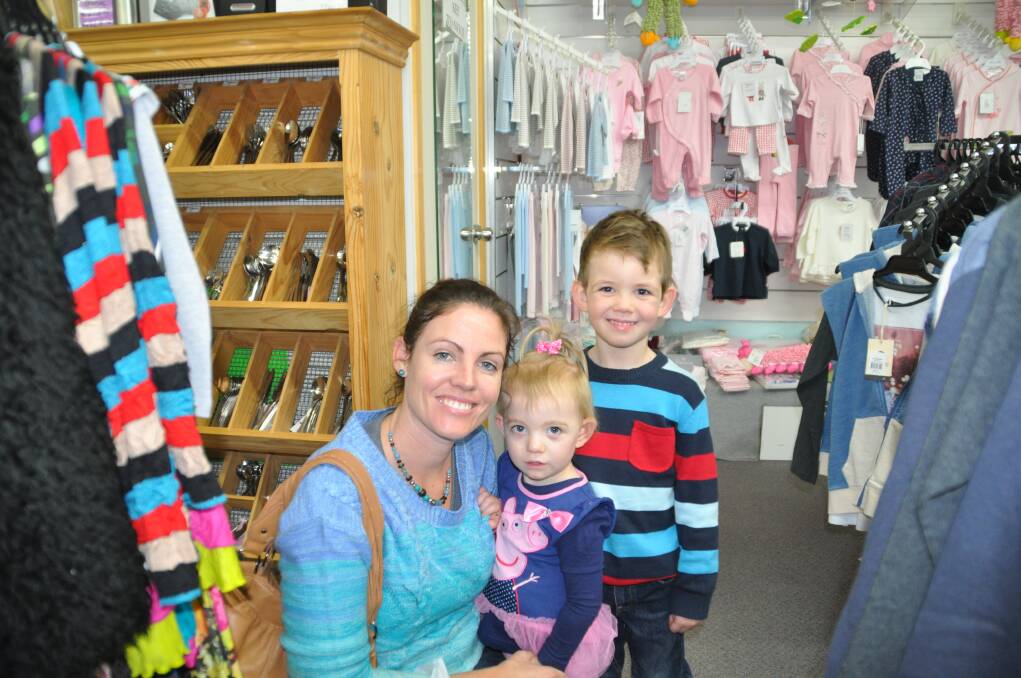 Bargain hunters: Robyn, Lara and Josiah Blackmore from Port Macquarie enjoying the Hastings Co-op Shareholders' Sale on Friday at The Department Store.