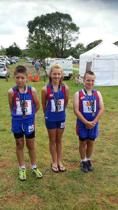Best efforts: Riley Farrington, Sara Slater and Will Dakin each won medals at the meet.